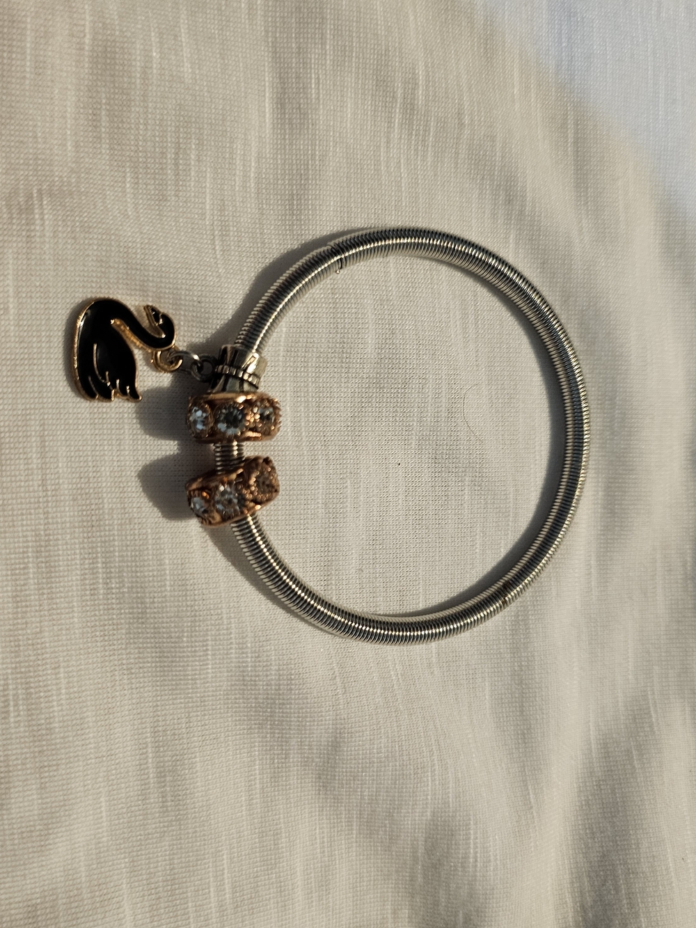 Elegant Silver-Tone Bracelet with Rose Gold Crystal Beads and Swan Charm